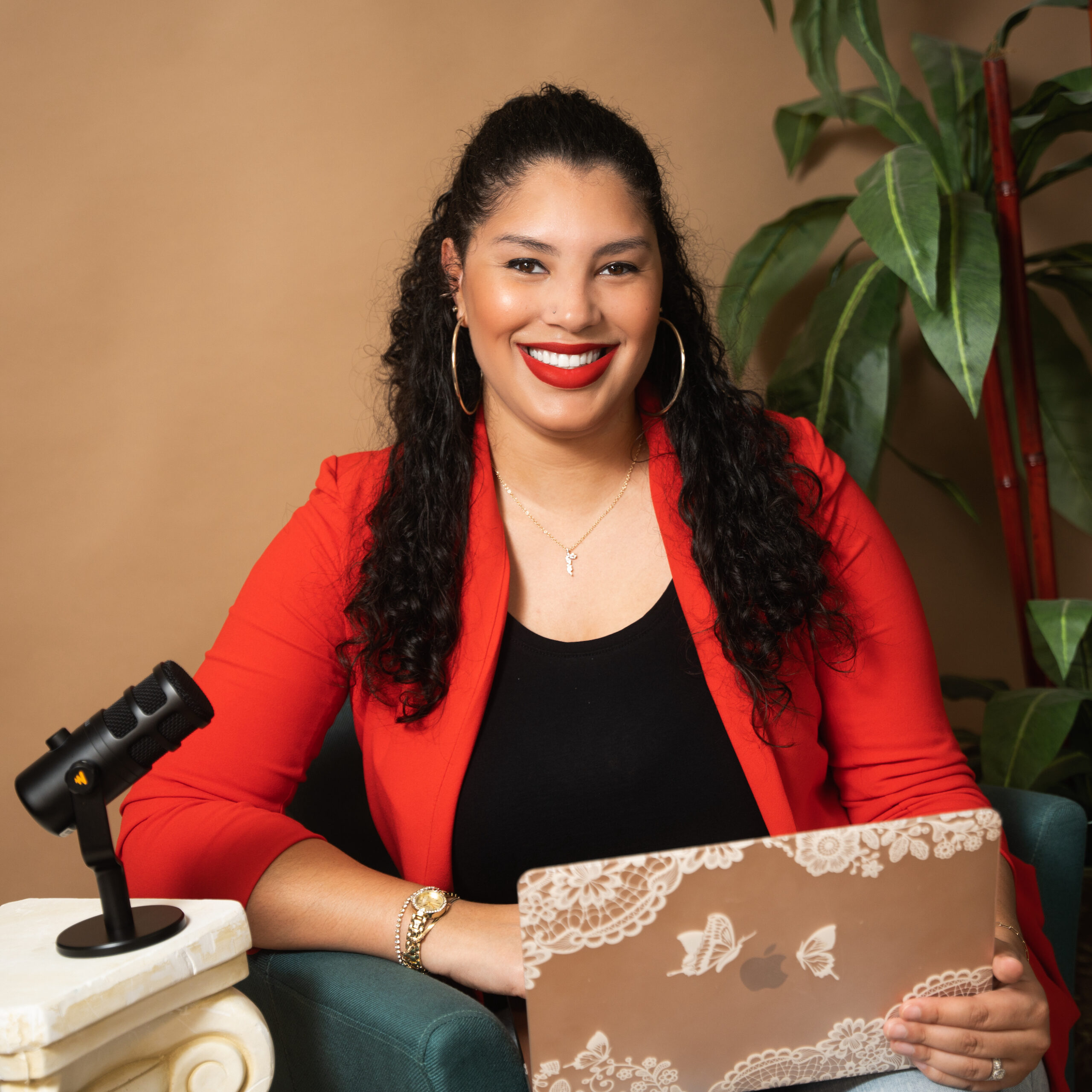 Podcaster headshot with podcast mic and laptop